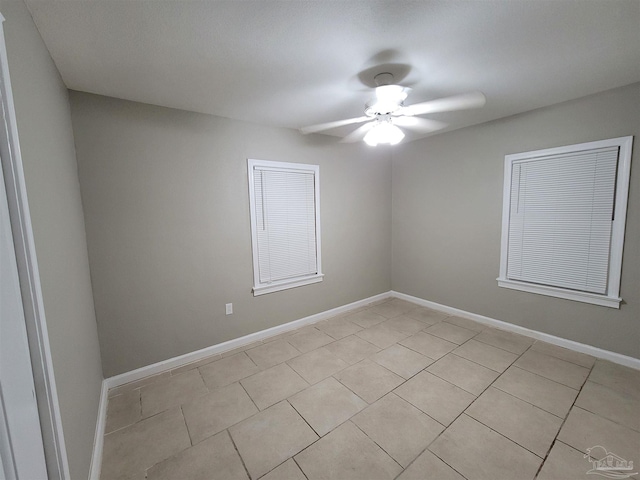 907 Colbert Ave, Pensacola, FL 32507 - unfurnished room featuring a ceiling fan and light tile patterned flooring