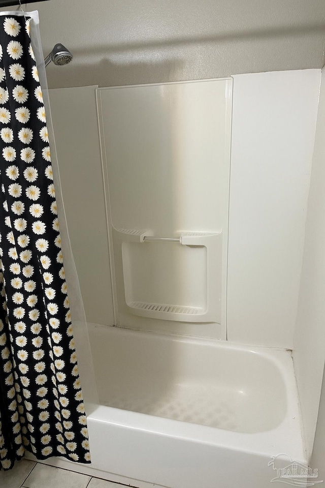 907 Colbert Ave, Pensacola, FL 32507 - full bath featuring tile patterned floors and shower / tub combo with curtain