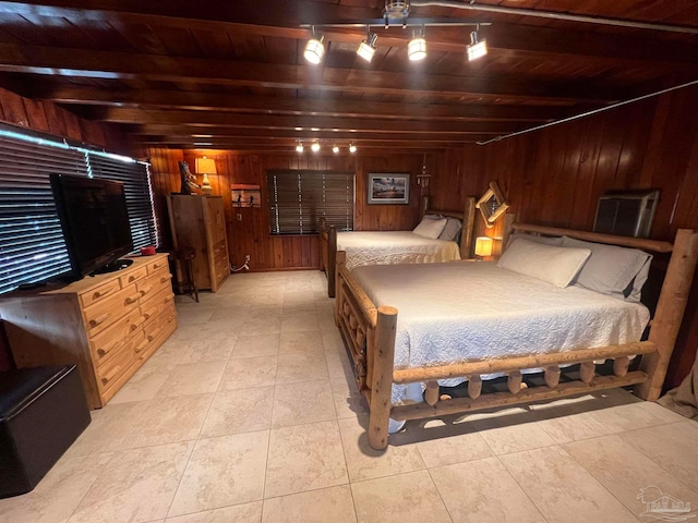 bedroom featuring wood walls, beamed ceiling, wood ceiling, and light tile patterned floors