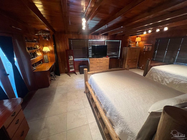 tiled bedroom with wooden ceiling, wood walls, and beam ceiling