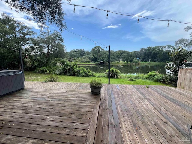 wooden deck with a water view