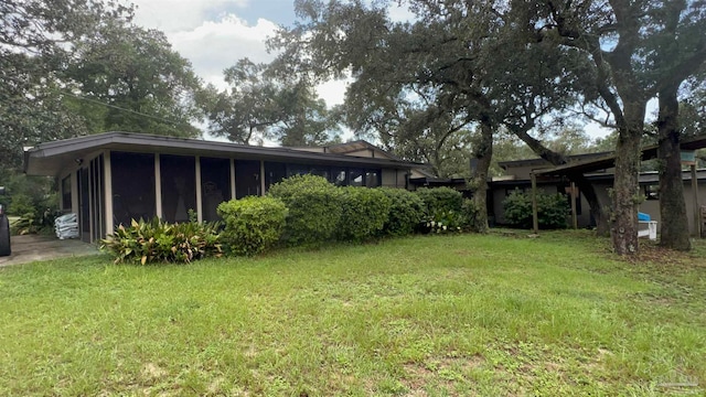 view of yard with a sunroom