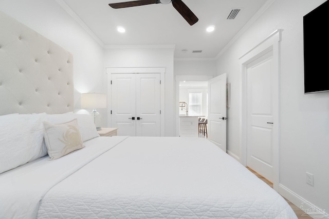 bedroom featuring crown molding, recessed lighting, baseboards, and visible vents