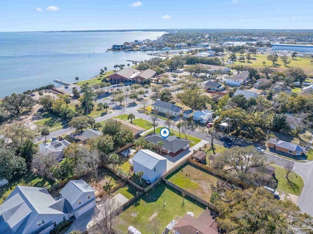 drone / aerial view featuring a water view and a residential view