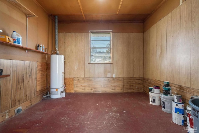 interior space with wooden walls and water heater