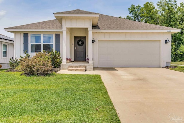 3488 Fallschase Blvd, Pensacola, FL 32526 - view of front facade featuring a shingled roof, board and batten siding, and an attached garage