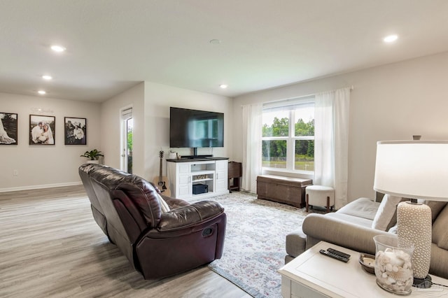 3488 Fallschase Blvd, Pensacola, FL 32526 - living area featuring light wood-style flooring, recessed lighting, a fireplace, and baseboards