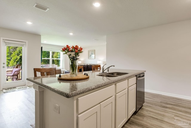 3488 Fallschase Blvd, Pensacola, FL 32526 - kitchen with a sink, light wood-type flooring, stone countertops, a center island with sink, and recessed lighting