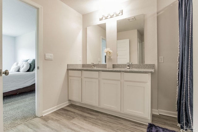 3488 Fallschase Blvd, Pensacola, FL 32526 - ensuite bathroom with wood finished floors, double vanity, and baseboards
