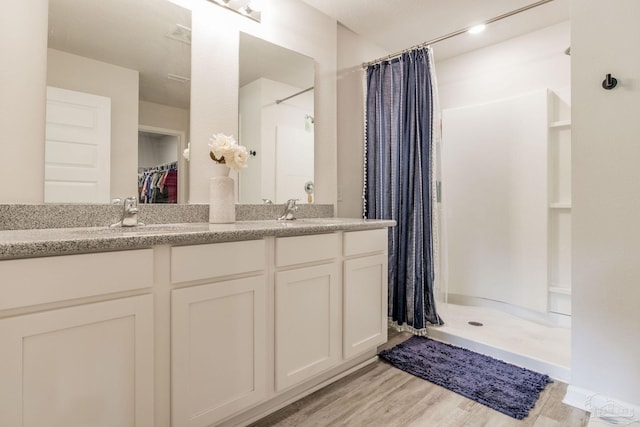 3488 Fallschase Blvd, Pensacola, FL 32526 - full bath with a stall shower, wood finished floors, a spacious closet, and double vanity
