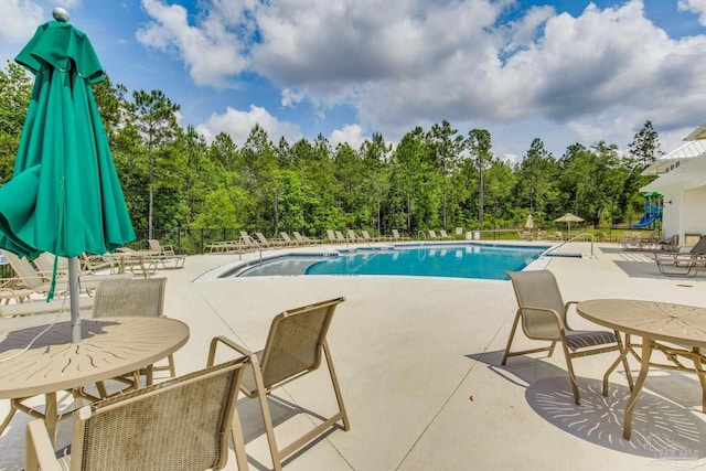 3488 Fallschase Blvd, Pensacola, FL 32526 - community pool featuring a patio area and view of wooded area