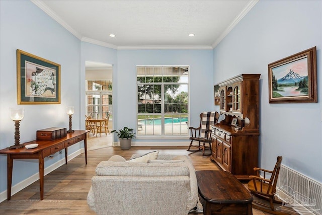 2520 Abbie Elizabeth Ct, Gulf Breeze, FL 32563 - sitting room featuring ornamental molding, wood finished floors, and recessed lighting