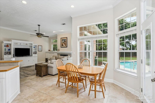 2520 Abbie Elizabeth Ct, Gulf Breeze, FL 32563 - dining area with healthy amount of natural light, crown molding, light tile patterned flooring, ceiling fan, and recessed lighting