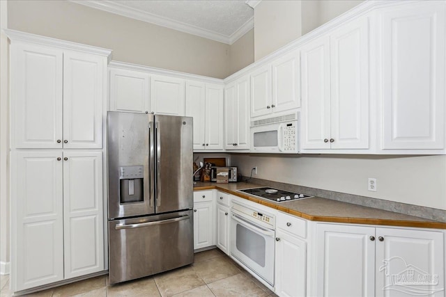 2520 Abbie Elizabeth Ct, Gulf Breeze, FL 32563 - kitchen with white appliances, ornamental molding, white cabinetry, and light tile patterned floors