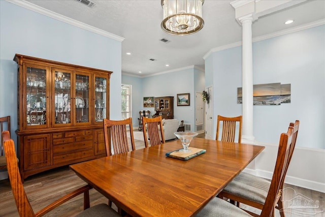 2520 Abbie Elizabeth Ct, Gulf Breeze, FL 32563 - dining space with ornate columns, wood finished floors, ornamental molding, and recessed lighting