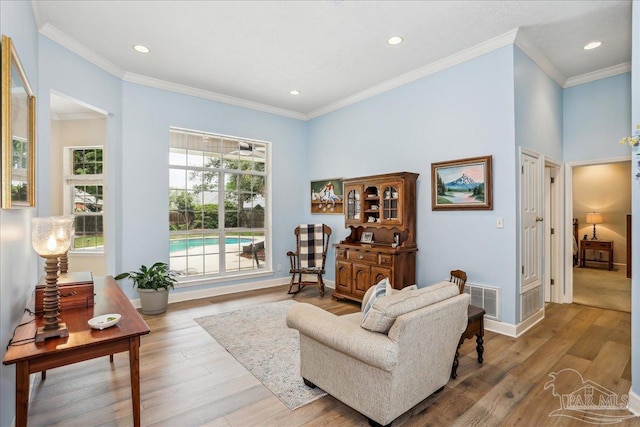 2520 Abbie Elizabeth Ct, Gulf Breeze, FL 32563 - living room with recessed lighting, wood finished floors, ornamental molding, and a towering ceiling