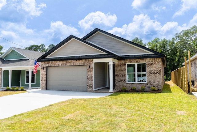 view of front of house with a garage and a front yard