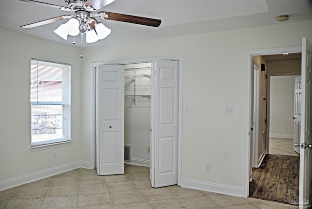 unfurnished bedroom featuring a closet and ceiling fan