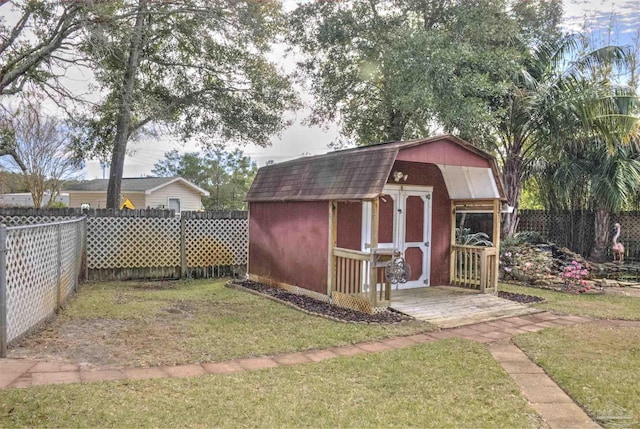 view of outbuilding with a lawn