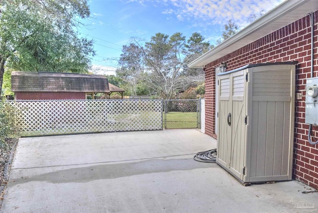 view of patio featuring a storage shed