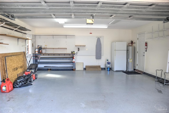 garage featuring water heater, white fridge, a garage door opener, and a workshop area