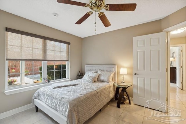 bedroom with light tile patterned flooring and ceiling fan