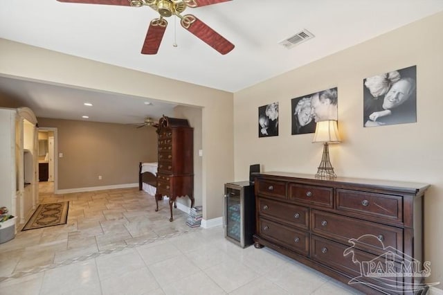 interior space featuring light tile patterned flooring and ceiling fan