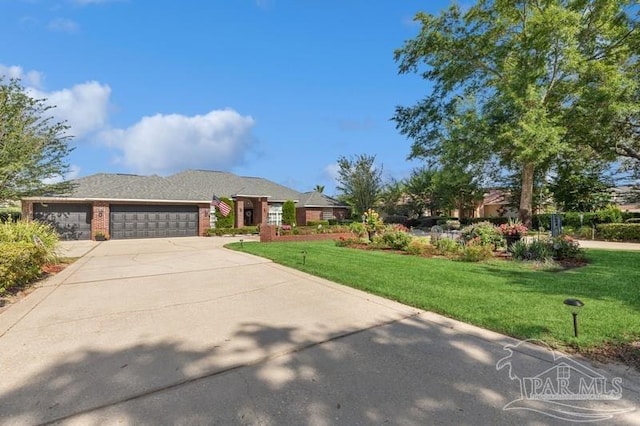 view of front of home featuring a garage and a front lawn