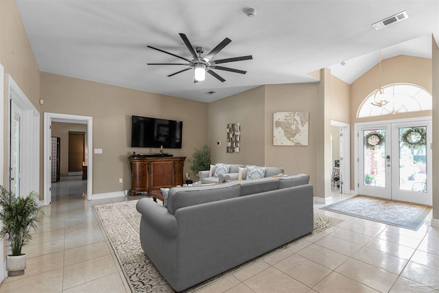 living room with vaulted ceiling, french doors, light tile patterned floors, and ceiling fan