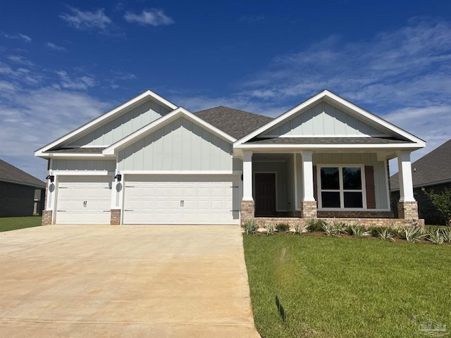 craftsman house with a garage and a front yard