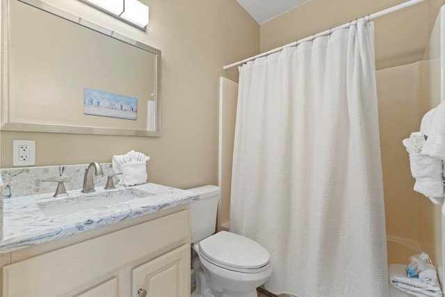 full bathroom featuring toilet, vanity, and shower / bath combo