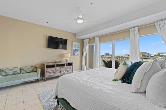 bedroom featuring ceiling fan, access to exterior, and light tile patterned floors