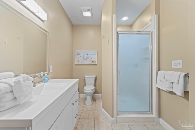 bathroom featuring tile patterned floors, toilet, walk in shower, and vanity