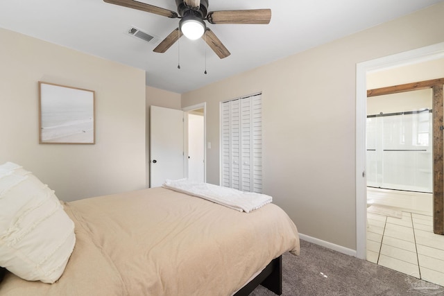 bedroom with visible vents, baseboards, ceiling fan, ensuite bathroom, and carpet floors