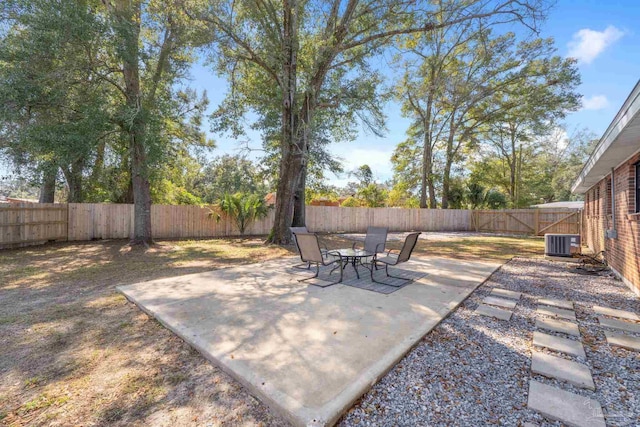 view of patio with central air condition unit and a fenced backyard