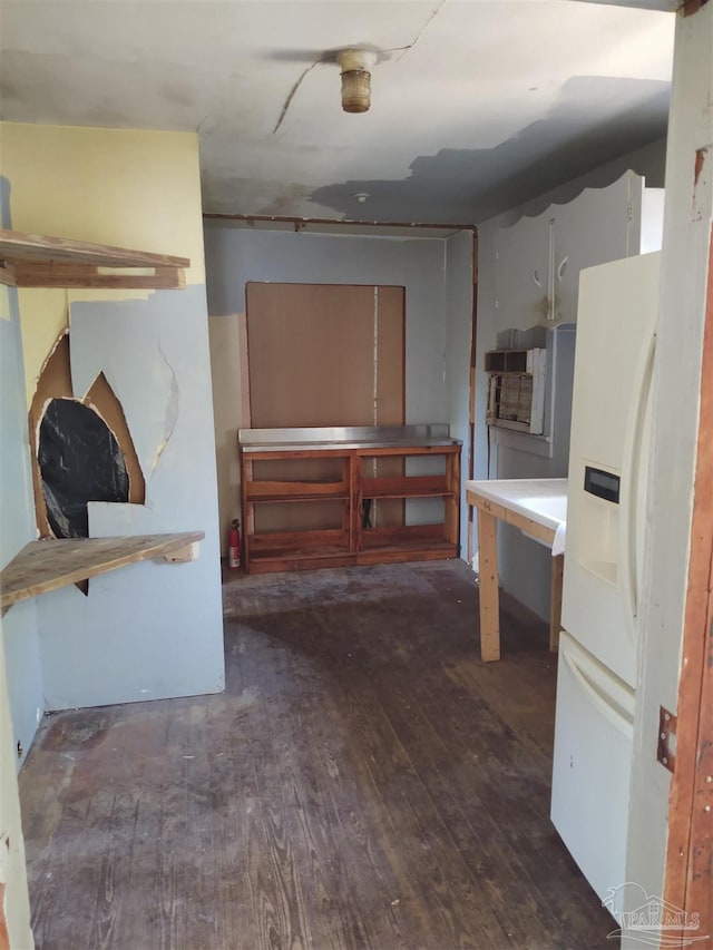 kitchen with white fridge with ice dispenser and wood-type flooring