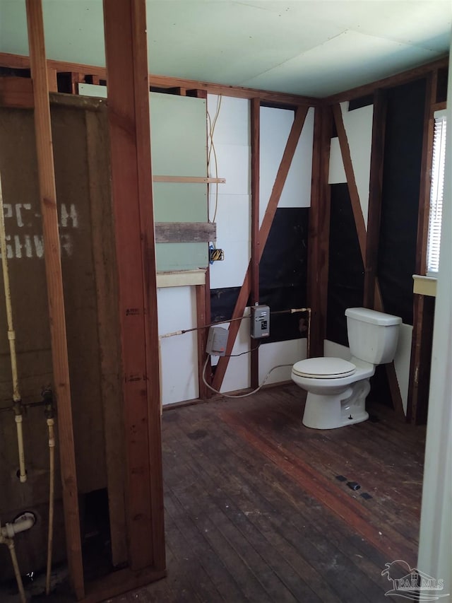 half bathroom featuring toilet and hardwood / wood-style floors