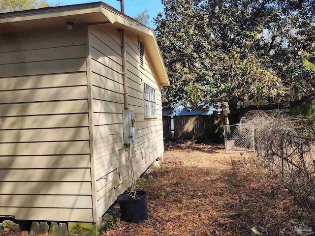 view of home's exterior featuring fence