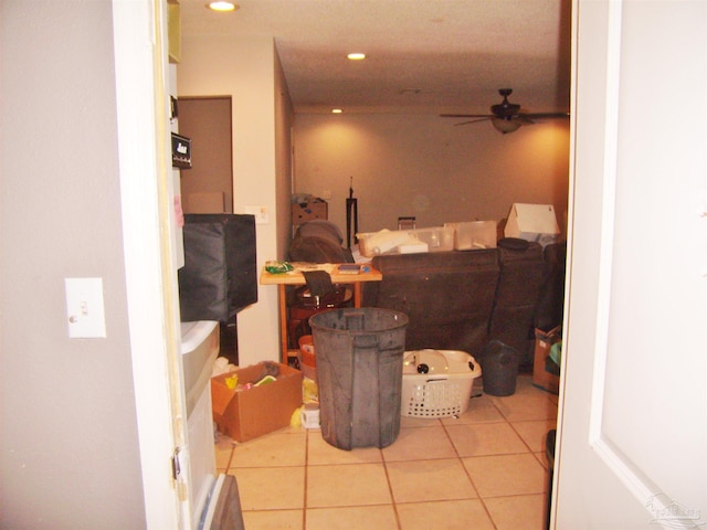 interior space featuring ceiling fan and tile patterned floors