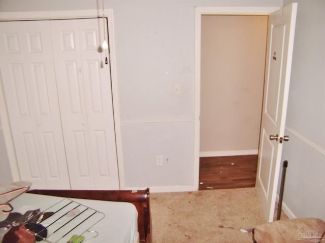 carpeted bedroom with a closet