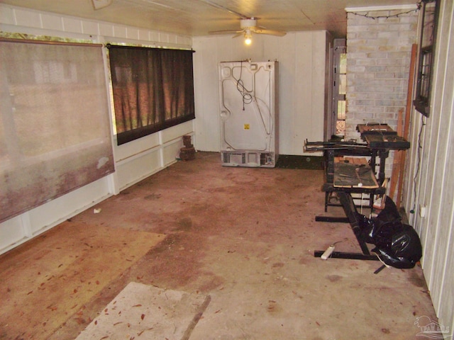 interior space with concrete floors and ceiling fan