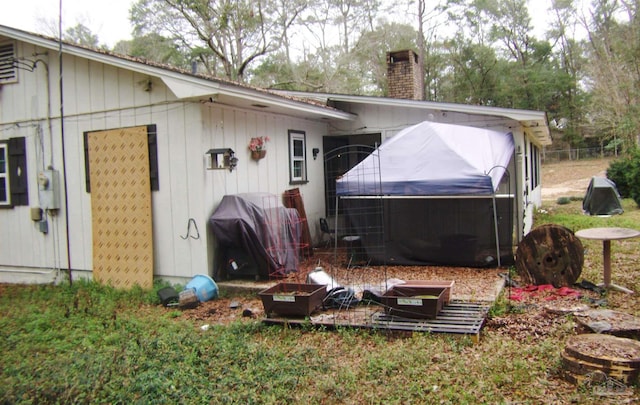 exterior space featuring a hot tub