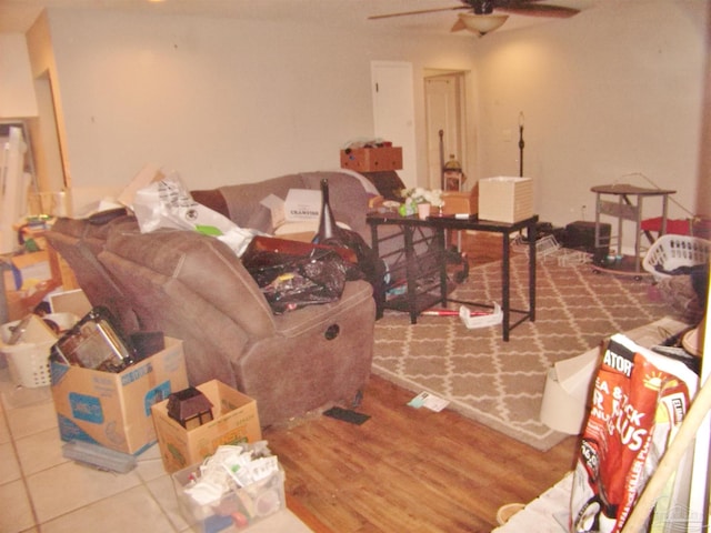 living room with hardwood / wood-style floors and ceiling fan