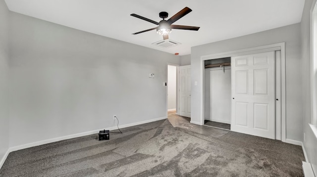 unfurnished bedroom with carpet flooring, ceiling fan, and a closet