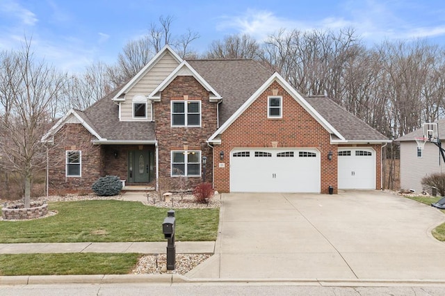 view of front of house featuring roof with shingles, brick siding, an attached garage, driveway, and a front lawn