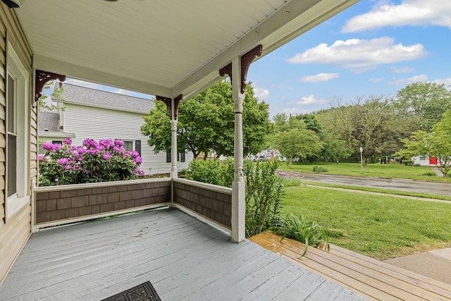 636 Callowhill St, Wooster, OH 44691 - wooden porch featuring a lawn