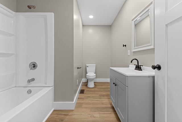 636 Callowhill St, Wooster, OH 44691 - bathroom featuring vanity, wood finished floors, toilet, baseboards, and  shower combination