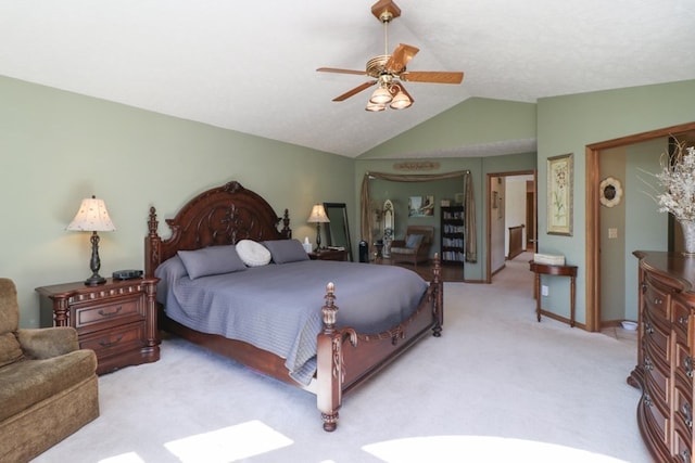 bedroom featuring carpet floors, baseboards, vaulted ceiling, and a ceiling fan