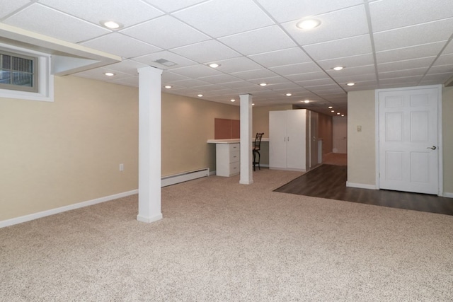 finished basement featuring carpet floors, baseboards, baseboard heating, and recessed lighting