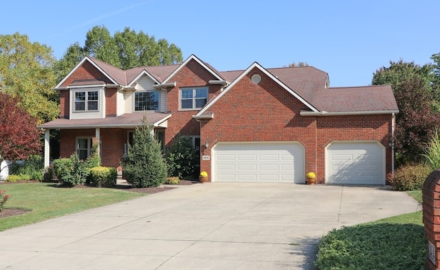 view of front of home with a garage, concrete driveway, brick siding, and a front lawn